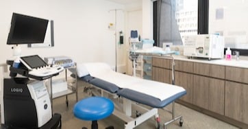 The interior of a clinic examination room at OT&P surrounded by state-of-the-art healthcare equipment